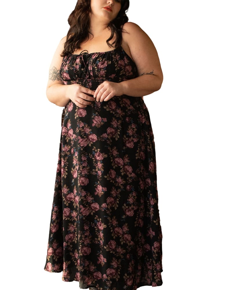 Front of a model wearing a size XL Alaia Midi Dress Floral Print Adjustable Straps in Black by ANNICK. | dia_product_style_image_id:282062